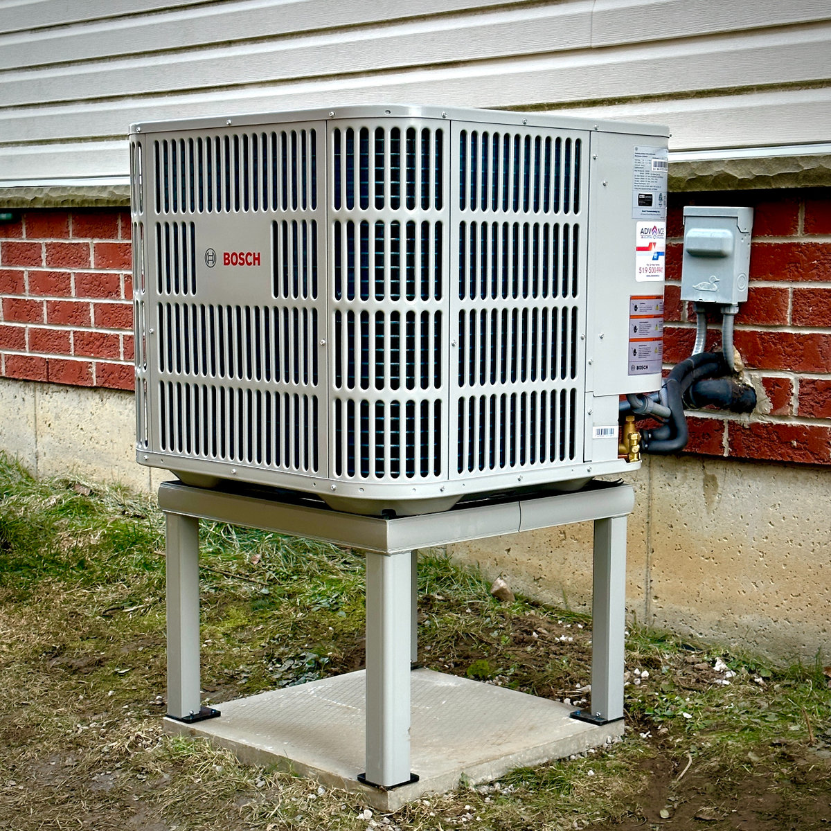 Bosch heat pump unit maintenance outside a residential home